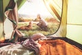 Woman pand her dog tender scene near the camping tent. Active leisure, traveling with pet concept image Royalty Free Stock Photo