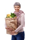 Woman, paper bag and portrait with vegetables for shopping, groceries and consumer for nutrition and fruits in studio Royalty Free Stock Photo