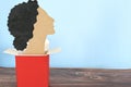 Woman paper cutout coming outside of box. Women coming out, empowerment and freedom concept Royalty Free Stock Photo