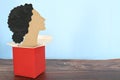 Woman paper cutout coming outside of box. Women coming out, empowerment and freedom concept