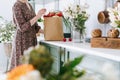 Woman with paper grocery bag in kitchen Royalty Free Stock Photo