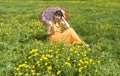 Woman with parasol and yellow dandelions Royalty Free Stock Photo