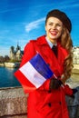 Woman in Paris with French flag looking into the distanc Royalty Free Stock Photo