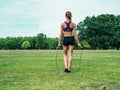 Woman in park exercising with jump rope Royalty Free Stock Photo