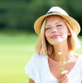 Woman, park and peace with thinking, flower and eyes closed with peace, relax and memory outdoor in summer. Girl, garden