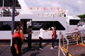 Woman passenger boarding ferry to St John`s Island at Marina South Pier; her temperature taken by staff during coronavirus