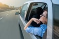 Woman passenger in self-driving car