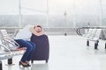 Woman passenger sleeping in the airport