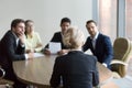 Woman passing job interview at office, interviewers on backgroun Royalty Free Stock Photo