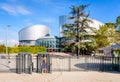 A woman is passing the security turnstile of the European Court of Human Rights building in Strasbourg, France Royalty Free Stock Photo