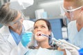 Woman patient dental check dentist team