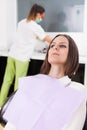 Woman patient at the dentist waiting to be checked up