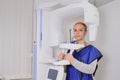 Woman patient doing panoramic teeth x-ray