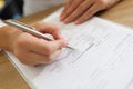 Woman patient filling medical form in clinic Royalty Free Stock Photo