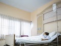 Woman patient in hospital bed Royalty Free Stock Photo