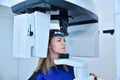 Woman patient make a panoramic computer tomograph in clinic Royalty Free Stock Photo