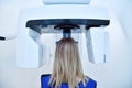 Woman patient make a x-ray picture on dental panoramic tomograph Royalty Free Stock Photo