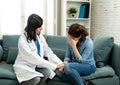 Woman patient receiving bad news. Friendly Doctor comforting and support sad patient with empathy Royalty Free Stock Photo