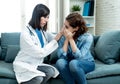 Woman patient receiving bad news. Friendly Doctor comforting and support sad patient with empathy Royalty Free Stock Photo