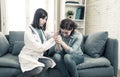 Woman patient receiving bad news. Friendly Doctor comforting and support sad patient with empathy Royalty Free Stock Photo