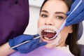 Woman patient undergoes dental treatment in private clinic Royalty Free Stock Photo