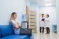 Woman patient waiting at hospital Doctors Waiting Room Royalty Free Stock Photo