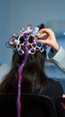 Woman patient wearing performant eeg headset scanning brain