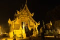 Woman pay respect to buddhism church at night