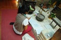 Woman pay respect at Wat Umong Chiangmai Thailand