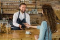 Woman paying bill through smartphone using NFC technology Royalty Free Stock Photo