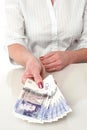 Woman is paying in british currency Royalty Free Stock Photo