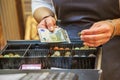 Woman is paying In cash with euro banknotes Royalty Free Stock Photo