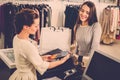 Woman paying with credit card in s showroom Royalty Free Stock Photo