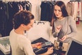 Woman paying with credit card in s showroom Royalty Free Stock Photo