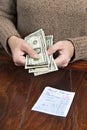 Woman paying dinner bill Royalty Free Stock Photo