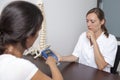 Woman paying the doctor with creditcard