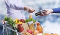 Woman paying for groceries with a credit card Royalty Free Stock Photo