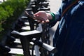 Woman paying rent of electric scooter using mobile app on street Royalty Free Stock Photo