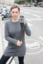 Woman pays at an electric car charging station