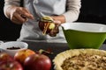 Woman pealing off apple skin