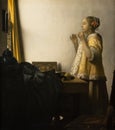 Woman with a pearl necklace,1663 by Dutch golden age painter Johannes Vermeer