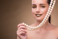 The woman with pearl necklace isolated on white Royalty Free Stock Photo