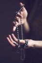 Woman with pearls in her hands Royalty Free Stock Photo