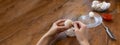 Woman peeling boiled egg on wooden background