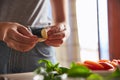 Woman peeling garlic whilst preparing dinner Royalty Free Stock Photo