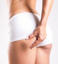 Woman with perfect body checking cellulite Royalty Free Stock Photo