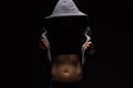 Woman with perfect body opens her hoodie and shows her trained abdominal muscles. Fitness, workout and training concept