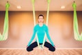 Woman performing antigravity yoga