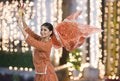 Woman performing Dandiya Raas on Navratri