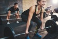 Woman performing dead lift barbell exercise Royalty Free Stock Photo